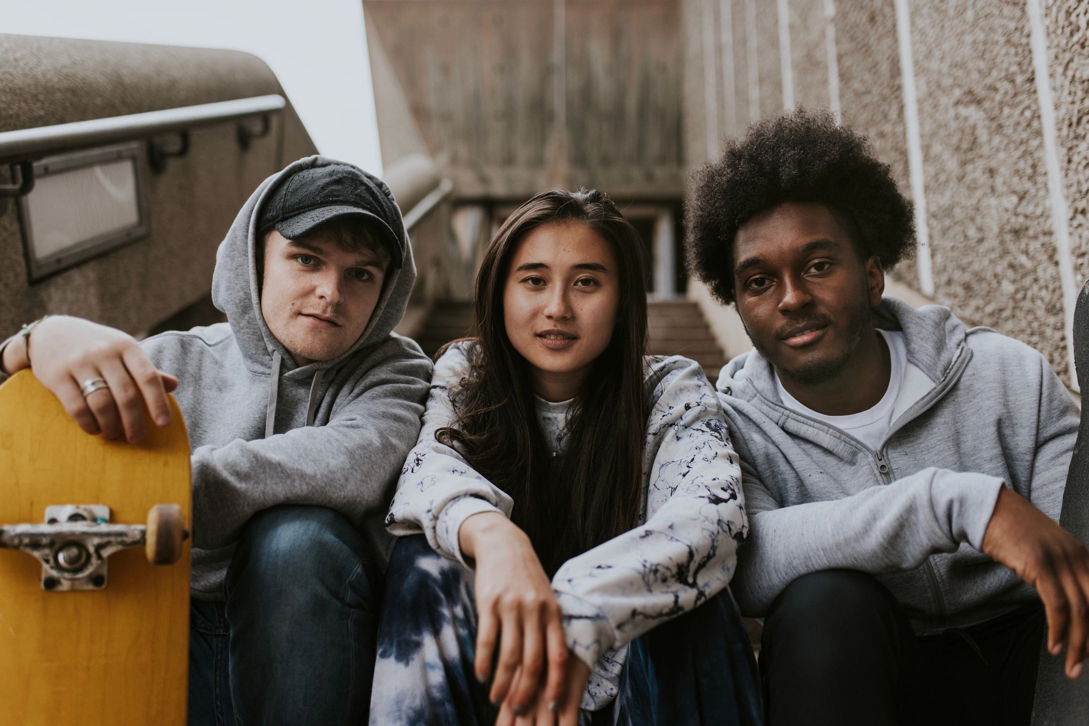Diverse skaters relaxing on steps
